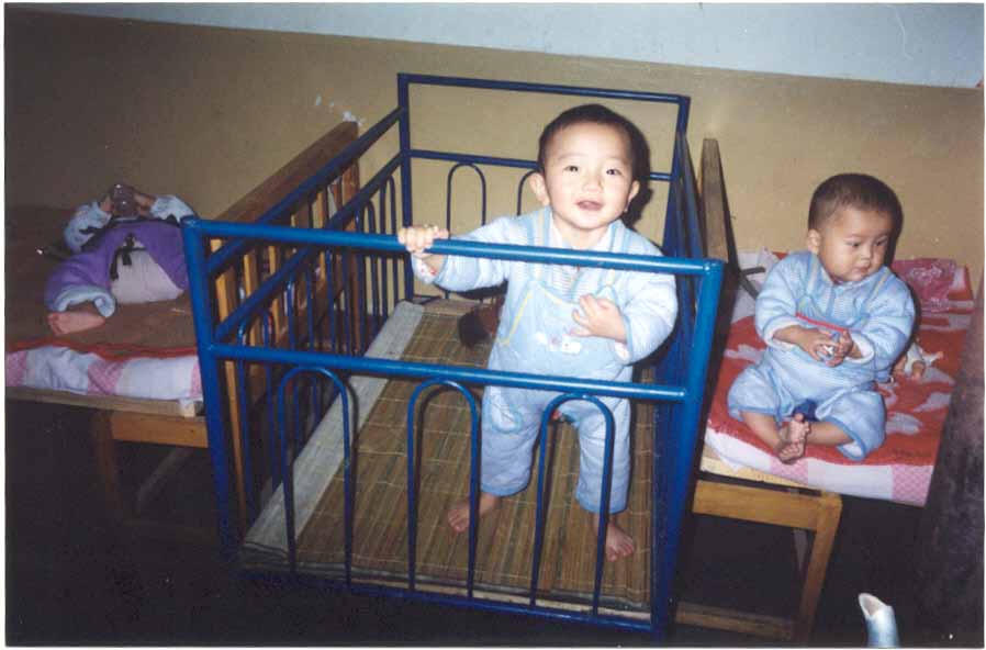 Wu Zhao smiling in her crib