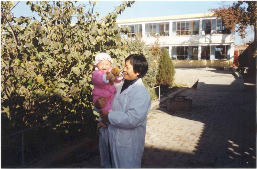 Wu Zhao outside with a caretaker